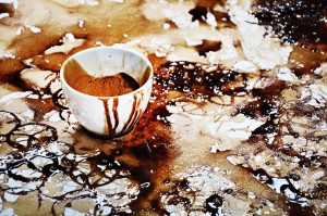 Close-up of a coffee cup on the canvas during Hong Yi’s coffee art creation