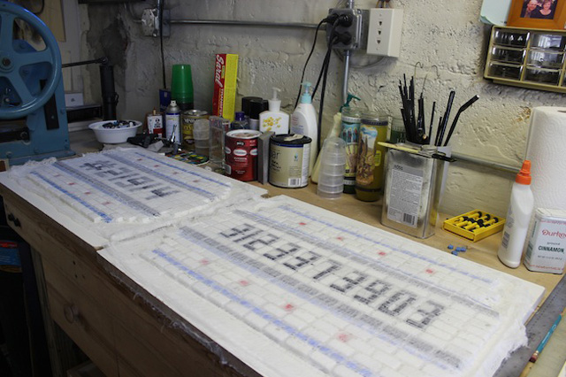 Jim Bachor in the process of creating his Chicago pothole mosaics