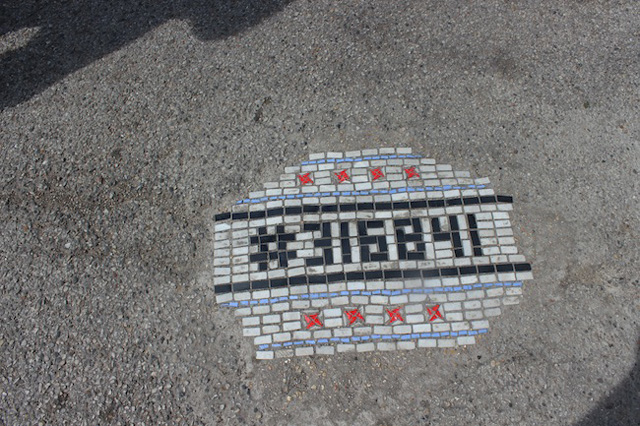 One of Jim Bachor's Chicago pothole mosaics after installation