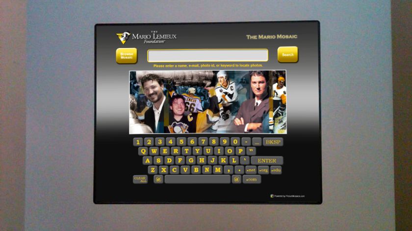 Interactive kiosk at the arena allowing visitors to search for their photos within the Mario Mosaic