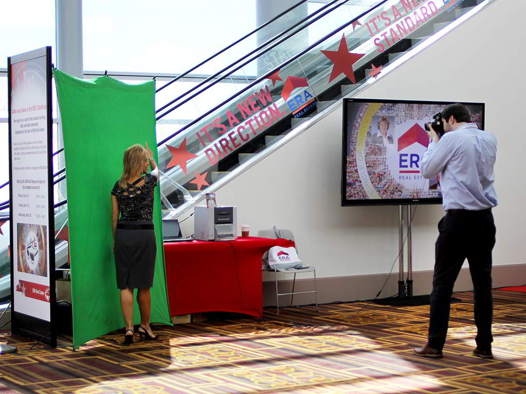 Guest having their photo taken for the ERA Realty mosaic activation