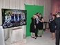 Three guests having their photo taken by an event tech for the GettysburGreat Fundraiser mosaic