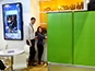 Event tech standing beside the interactive digital mosaic display