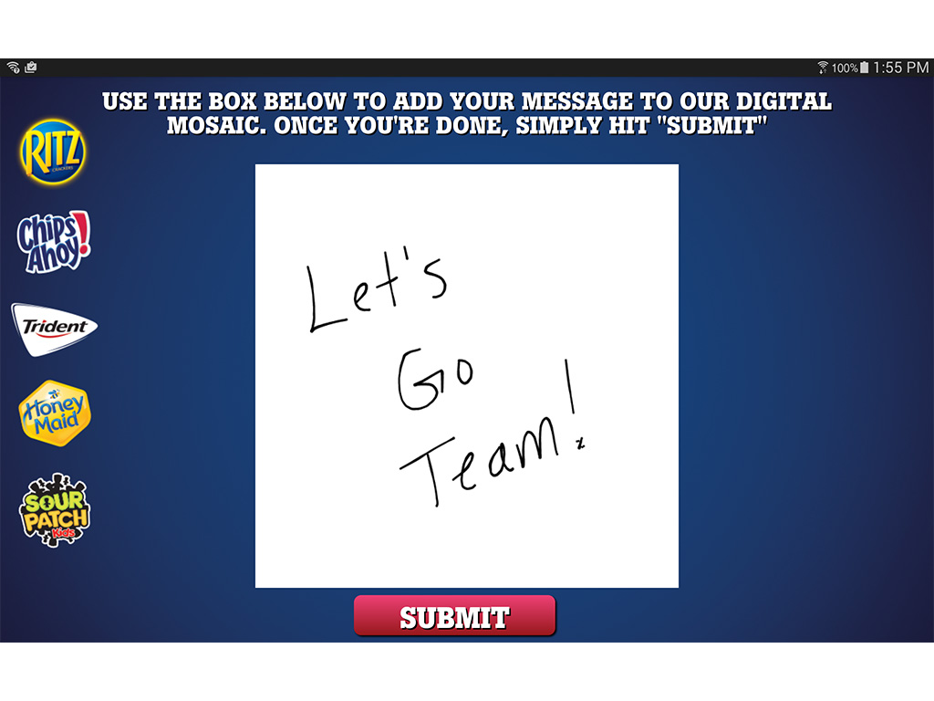 Guest sending a message near the U.S. Women's National Soccer Team Live Digital Mosaic wall