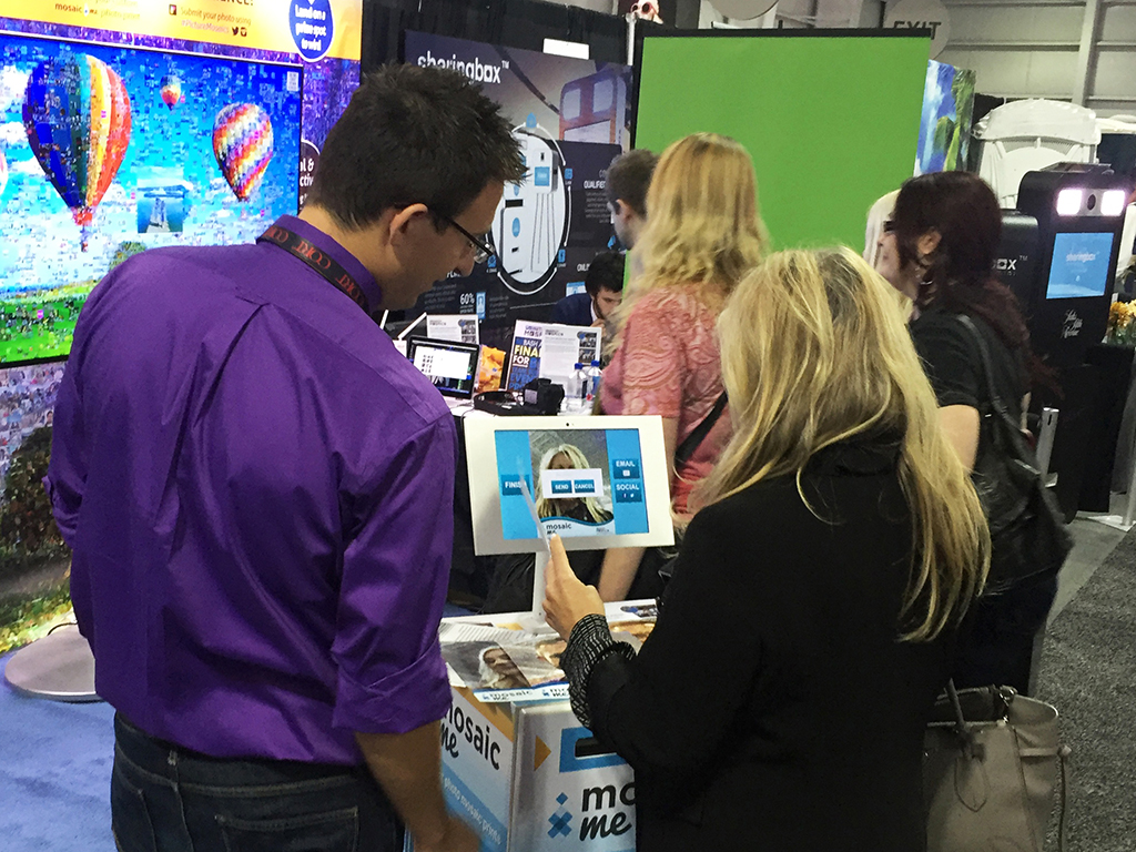 Event tech guiding a guest through the MosaicMe kiosk experience