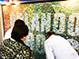 Guest viewing their portrait in the Live Print Mosaic at the ALA Annual Conference