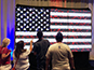 Guest interacting with the Live Digital Mosaic at PoliticalFest 2016