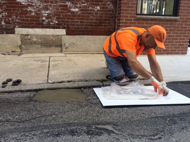 Installation of a Jim Bachor Pothole Mosaic