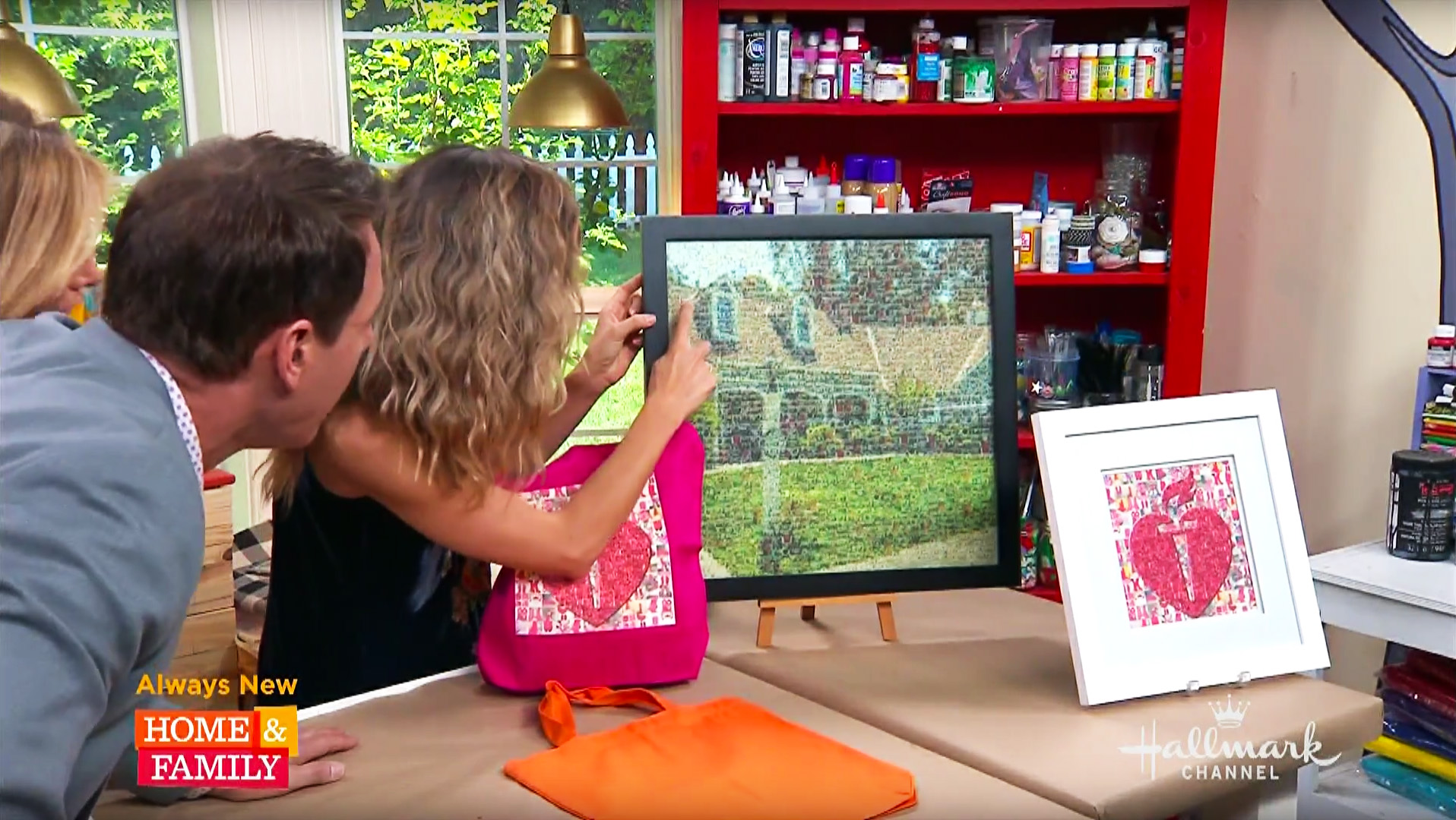 Hosts on the Hallmark channel gathered around a framed photo mosaic, pointing out all of the small photos inside