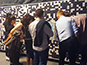 Guests viewing the building Live Print Mosaic at the Lidl Conference in Dublin