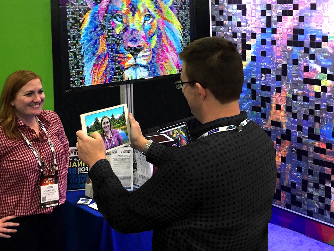 Event tech capturing a guest’s photo using the iPad kiosk station