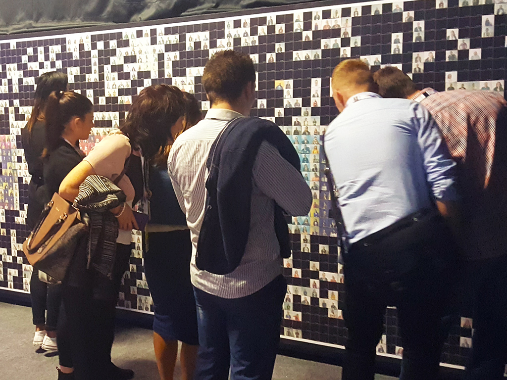 Guests viewing the in-progress Live Print Mosaic at the Lidl Conference in Dublin