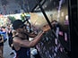 Placing photos in the mosaic at Mercedes’ Pride Toronto booth