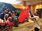 Guest using a tablet to capture a photo for the WorkHuman mosaic