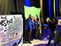 Group of attendees being photographed by event tech for mosaic participation