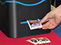 Guest retrieving their printed photo tile from the live mosaic printer