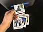 Guest retrieving printed photo tile from the live print mosaic station
