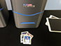 Photo mosaic printer setup with printed photo tiles on the table
