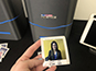 Guest smiling while holding printed photo tile at the Lidl Conference in Dublin