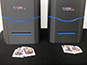 Live photo mosaic printers at Rutgers event with photo tiles ready for placement