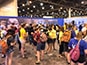 A busy event floor filled with guests eager to participate in the mosaic.