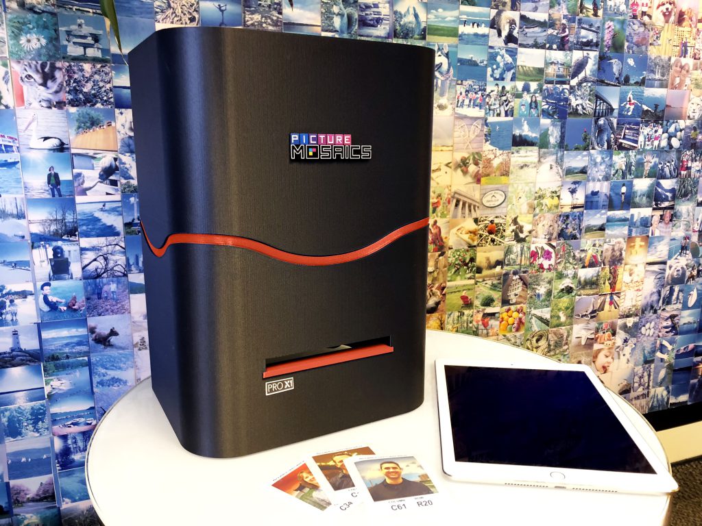 A Pro X1 printer alongside an iPad and some printed mosaic photos.