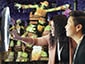 Two guests using a ringlight photobooth to submit a photo to the digital photo mosaic