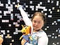 Thumbnail of a guest pointing out their mosaic image at the 2019 Special Olympics World Games.