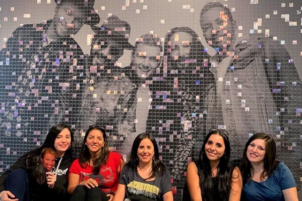 Backstreet Boys: The Experience – Group photo of fans in front of the mosaic wall.
