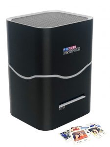 A Pro X1 Printer accompanied by a few printed photos.