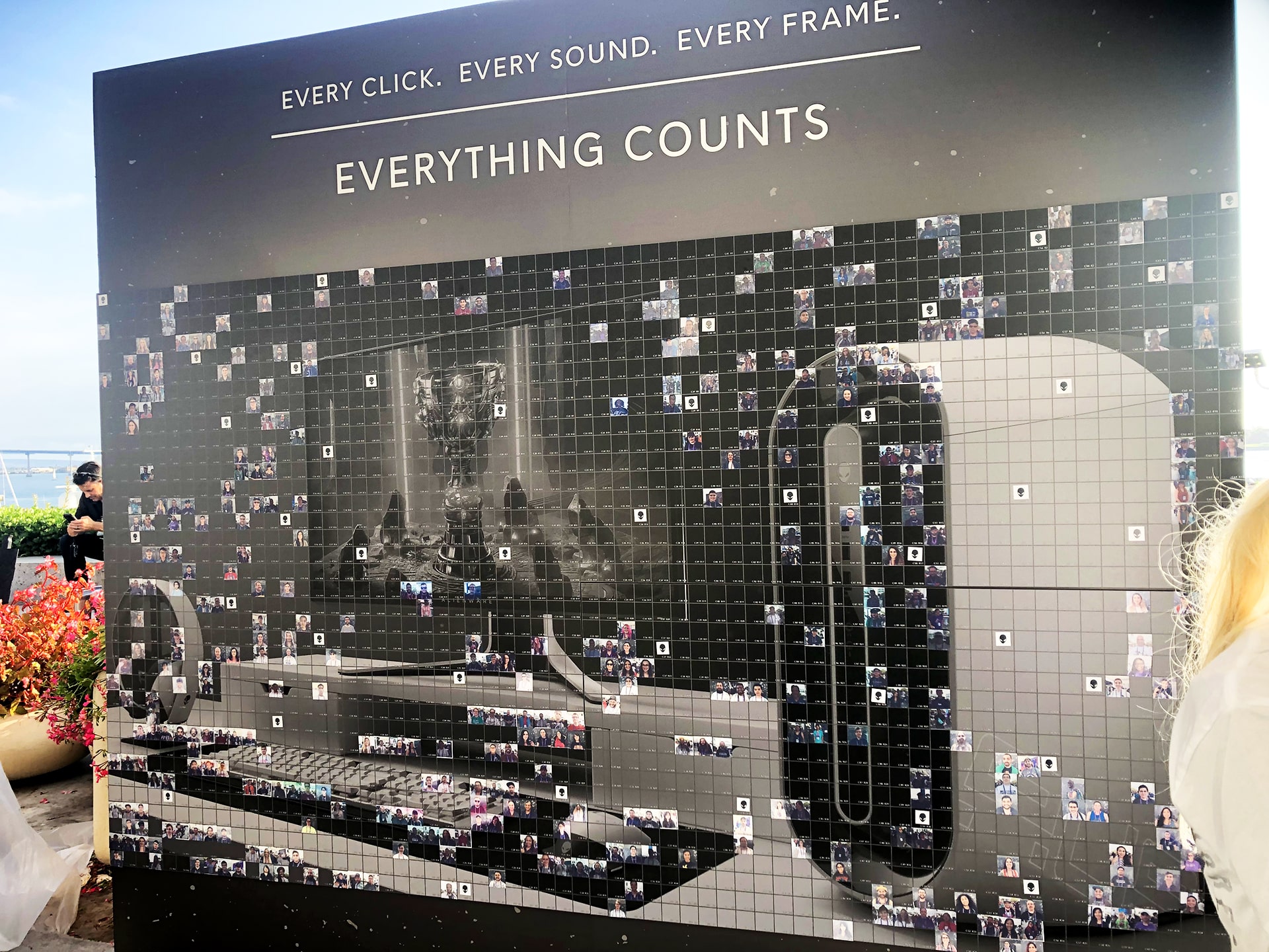 Progression of Alienware mosaic wall transitioning from black and white to full color
