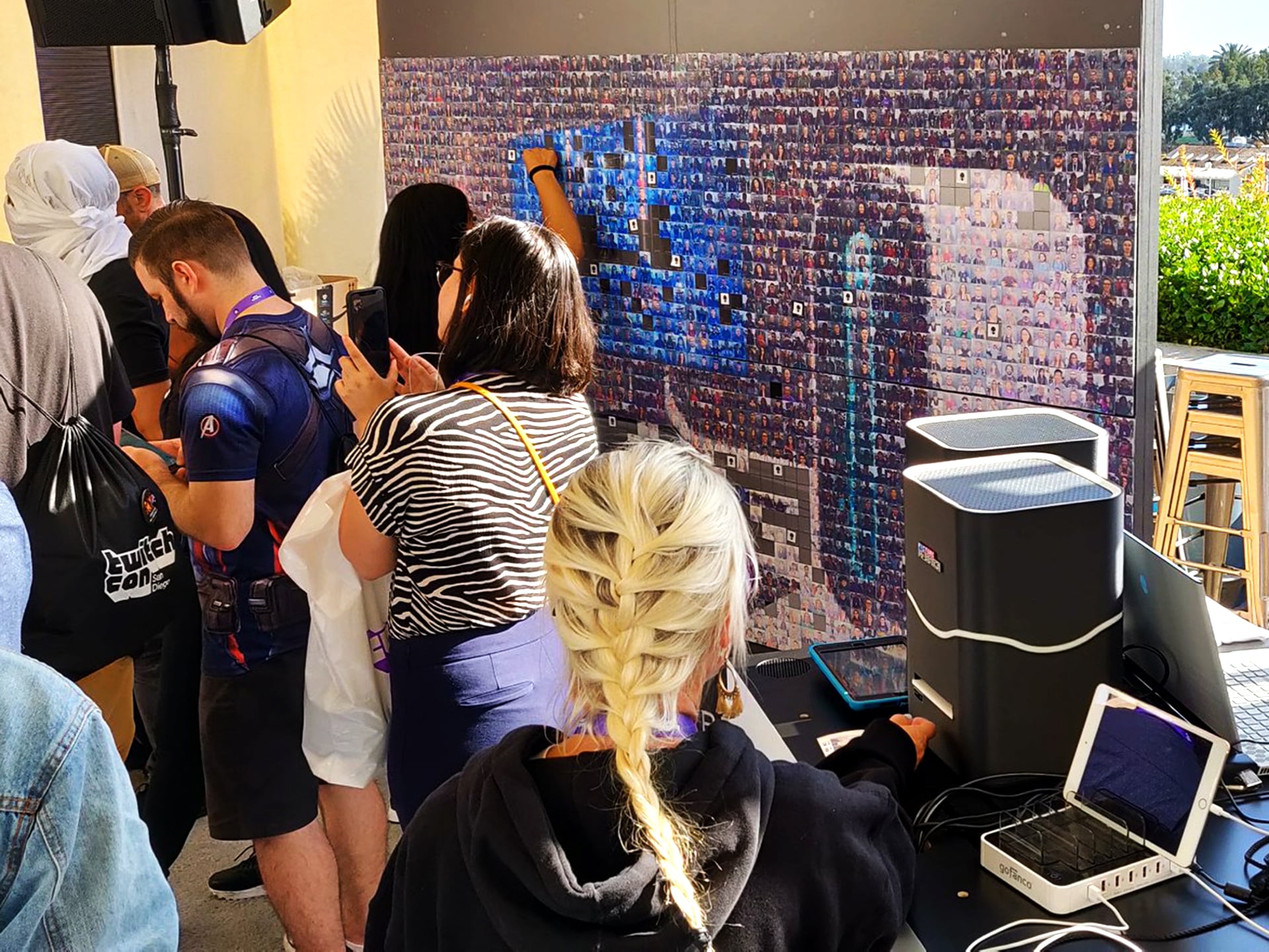 Guests capturing photos and placing mosaic tiles at Alienware’s TwitchCon booth