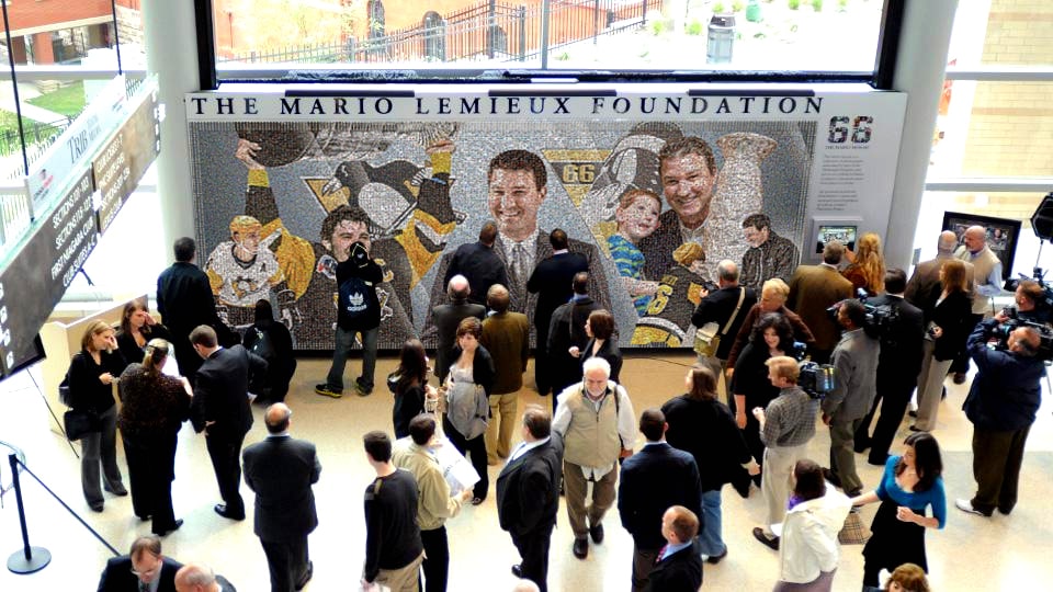 A wide shot of a spamm crowd admiring the Mario Mosaic 2.0.