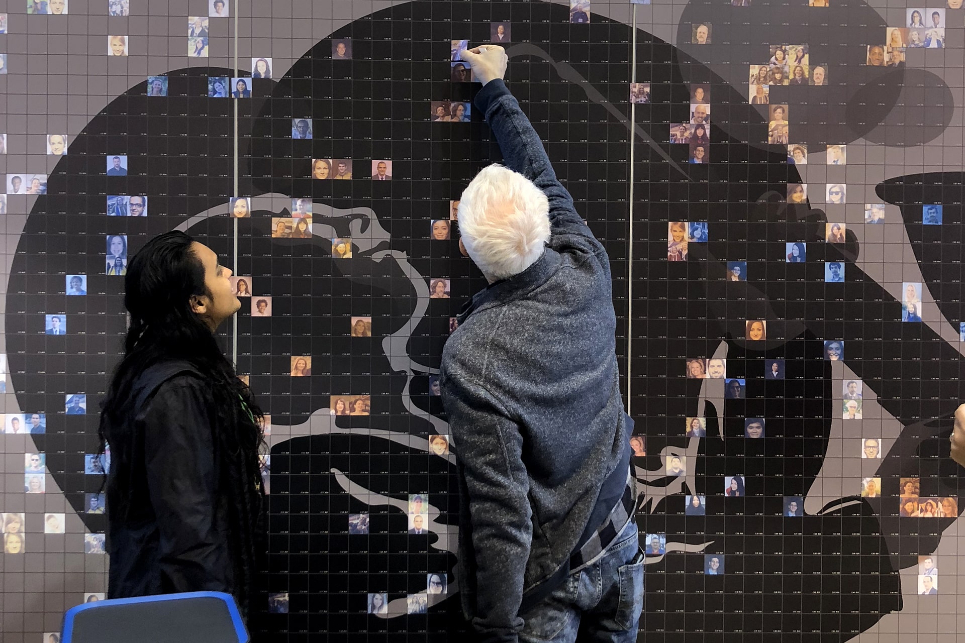 Another participant placing their photo onto the AARC 2019 Live Print Mosaic wall