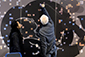 Another participant placing photo on mosaic wall at AARC 2019