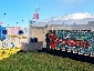 A wide shot of the completed Live Print Mosaic wall at Super Bowl LV, showcasing fan-submitted photos.