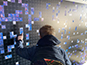 An individual mosaic photo highlighted in front of the building Live Print Mosaic.