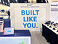 A completed SketchBot mosaic at the Viasat booth, showcasing a large mosaic artwork.