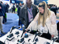 A brand ambassador capturing a guest's photo at the Viasat booth for the SketchBot mosaic.