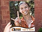 Guest viewing their photo mosaic mockup during the Texas Longhorn Orange-White Spring Game Live Print Mosaic Event