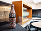 Full view of Coke bottle photo mosaic installation at Coca-Cola headquarters