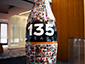 Coca-Cola 135th anniversary photo mosaic shaped like a giant Coke bottle