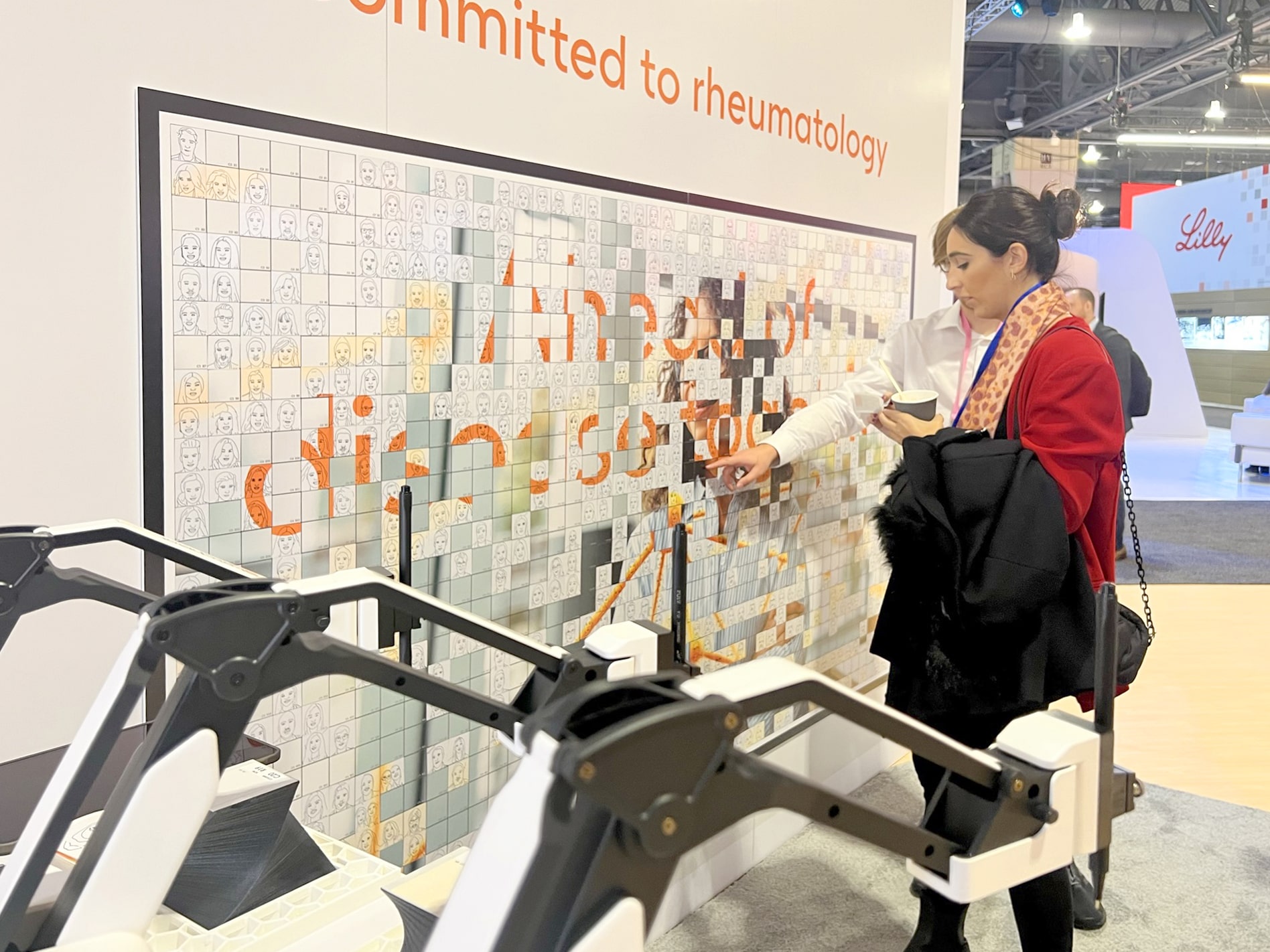 Attendee finding their sketch's placement on the mosaic grid.