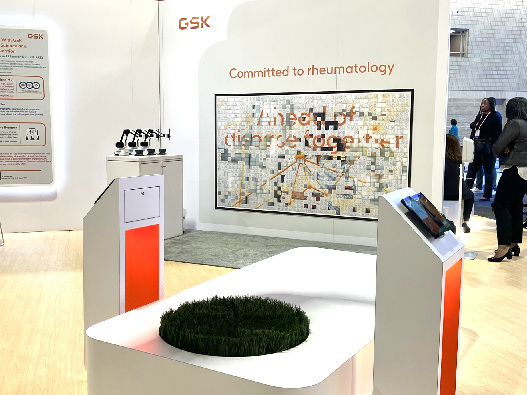 Wide shot of the GSK Sketch Mosaic booth with participants engaging.