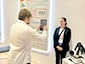 Attendee being photographed for the Sketch Mosaic experience.