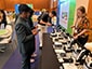 Event attendees recording SketchBot sketching their portraits for live mosaic experience
