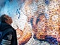 Guest viewing large-scale photo mosaic mural