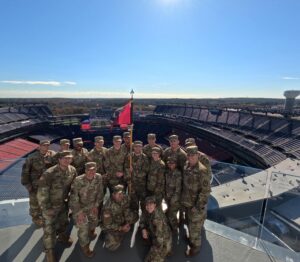 Military group posing for a photo at Gillette Stradium