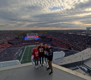 Fans posing for a photo at Gillette Stadium