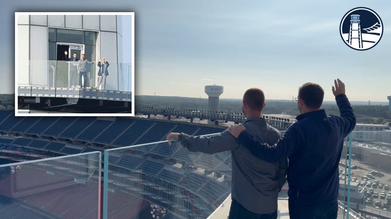 Fans participating in the photo mosaic experience at Gillette Stadium